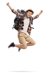 Fototapeta na wymiar Teenage tourist jumping and gesturing happiness
