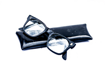 Close up of black full rim frame reading spectacles isolated on a white.