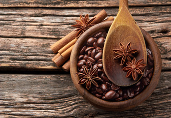 Coffee, anise, cinnamon  on wooden background.