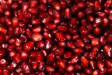 Food background of the fresh ripe pomegranate seeds