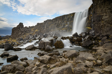 the Oxarafoss waterfall in the Thingvellir national park in Iceland, a geological and historic important region.