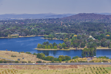 Fototapeta na wymiar Aerial landscape of Lake Burley Griffin and mountains from National Arboretum, Canberra, Australia