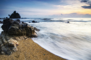 Travel and leisure concept, beautiful sea view scenery over stunning sunrise background.sunlight beam and soft wave hitting sandy beach