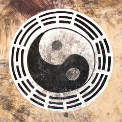 Black and white color yin yang circle on leather background