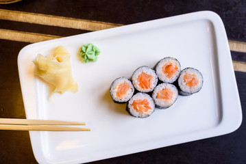 Fresh sushi rolls served on plate in restaurant