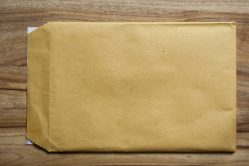 yellow envelope on a wooden table