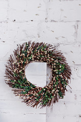 A wreath of twigs with spring decorations