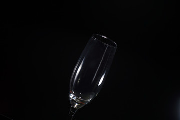 Desert liquor fine sand trickles into a champagne glass 

