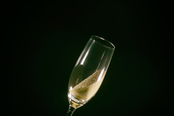 Desert liquor fine sand trickles into a champagne glass 
