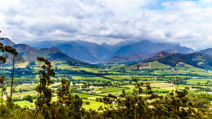 Franschhoek Valley in the Western Cape province of South Africa with its many vineyards that are part of the Cape Winelands, surrounded by the Drakenstein mountain range, as seen from Franschhoek Pass