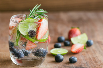 Infused water made from blueberry strawberry and lemon in sparkling mineral water look so freshness...