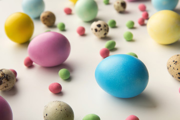 Easter background. Colored eggs on white, isolated