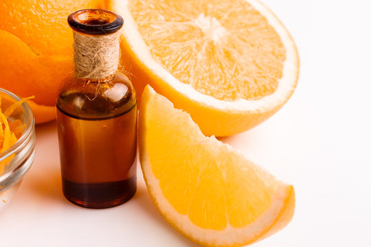 orange essential oil on a white background