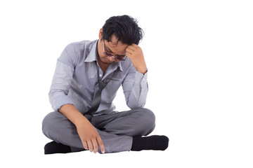 stressed businessman touching his head and thinking isolated on white