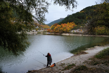 The fisherwoman by the lake near the Crimean Mangup-Kale mountain 