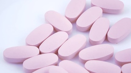 Oval pink tablets on plate