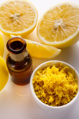 Lemon essential oil on a white background