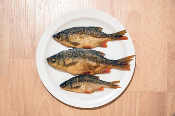 Small Fried river fish on the plate