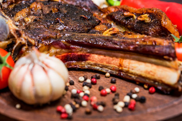 Tasty beef steak with spices and vegetables close