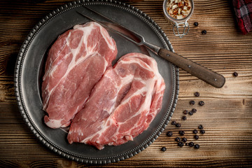 Slices of raw pork neck.