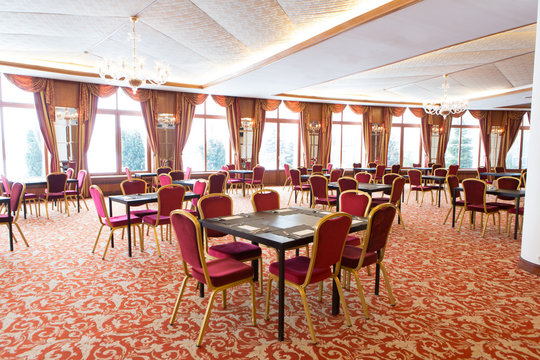 Big restaurant hall with served tables