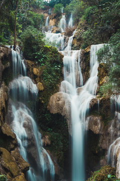 Beautiful cascade in green forest