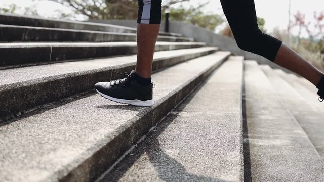 Young man runner at running for healthy.Running is an exercise as simple in order to make health of strong, Good health can not be traded,The man with runner up on stairs and running for exercise.