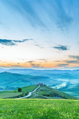 Fototapeta premium Landscape View in morning light with house on a hill