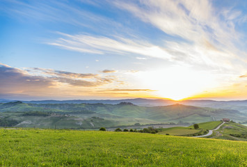 Fototapeta premium Morning light on a meadow in a rural Italian landscape