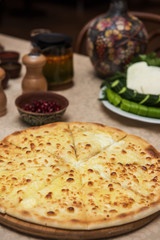 Meat ossetian pie on a table with georgian food