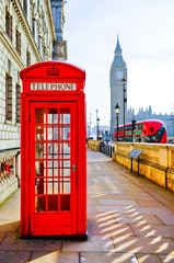Red telephone box and Big Ben in London. - obrazy, fototapety, plakaty