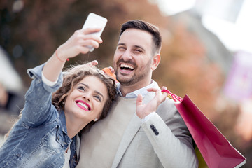 Young couple take selfie in the city