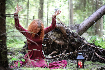 Witch holds a ritual sphere