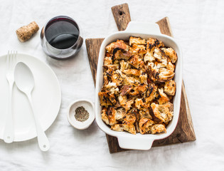 British baked tomato sauce bean and bacon with chunky crumbs topping on light background, top view. Flat lay