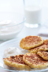 cheese pancake and milk on a white background.