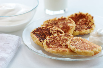 cheese pancake and milk on a white background.