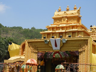 Entrance of the traditional stage decoration with Anthurium red, white carnation, Gladiolus and marigold, Lord venkateswara nama