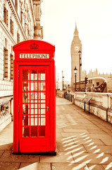 Red telephone box and Big Ben in London with vintage and isolated effect.