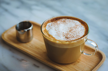 modern hot coffee in cup and delicious on table in coffee shop.