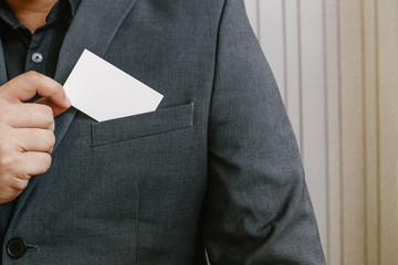 Man holding white business card,Man wearing blue shirt and showing blank white business card. Blurred background. Horizontal mockup, Smart asian business Person Professional Occupation cheerful