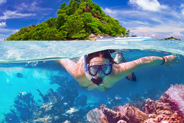 Young woman at snorkeling in the tropical water - obrazy, fototapety, plakaty