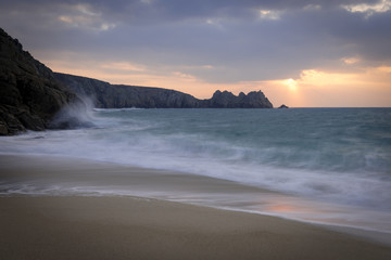 Porthcurno Beach at sunrise in West Cornwall.