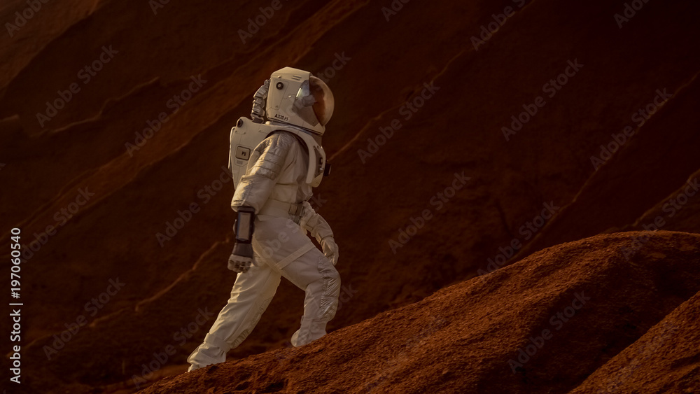Wall mural astronaut goes up the mountain to explore red planet/ mars. in the background his base and ai powere