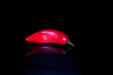 red pepper on black background