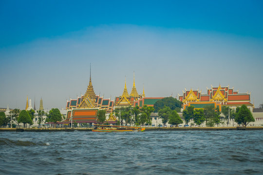 Outdoor view of Wat Pho or Wat Phra Chetuphon, 'Wat' means temple in Thai located in the horzont. The temple is one of Bangkok's most famous tourist sites in Thailand