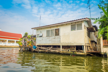 Fototapeta na wymiar Outdoor view of floating poor house on the Chao Phraya river. Thailand, Bangkok