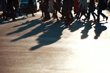 People walking on the street with sunset background