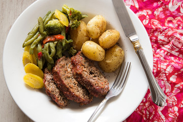 Meatloaf, potatoes and vegetables in a bowl