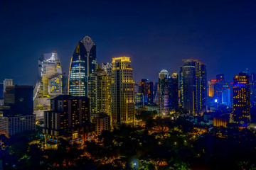 Fototapeta na wymiar Bangkok Night city skyline .Panoramic and perspective view light gold background of glass high rise building skyscraper commercial of future. Business concept of success industry tech architecture