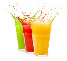 set of fruit juice glasses splashing isolated on white
